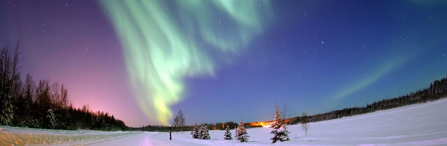 The Aurora Borealis, or Northern Lights, shines above Bear Lake, Alaska.